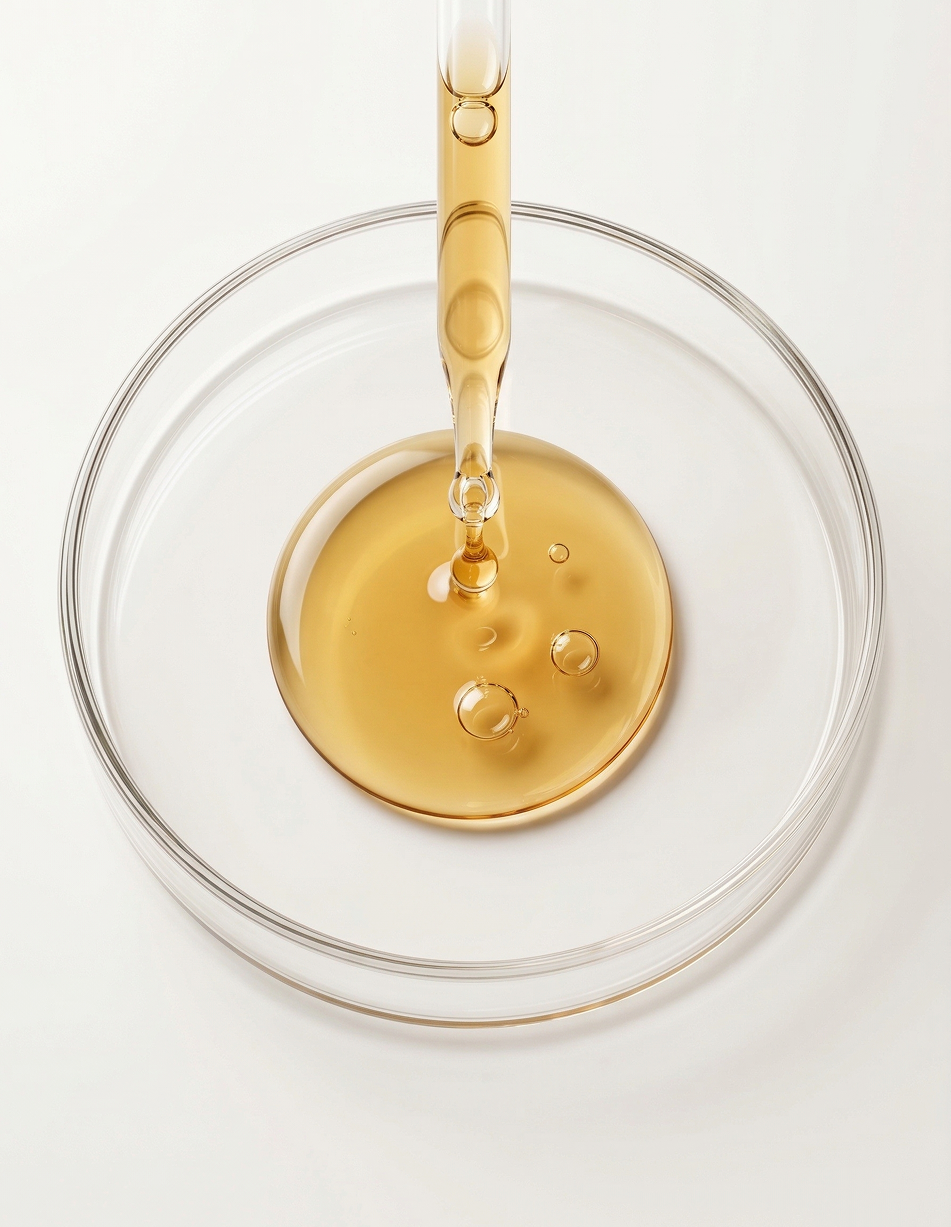 Amber liquid in a lab dish representing taurine